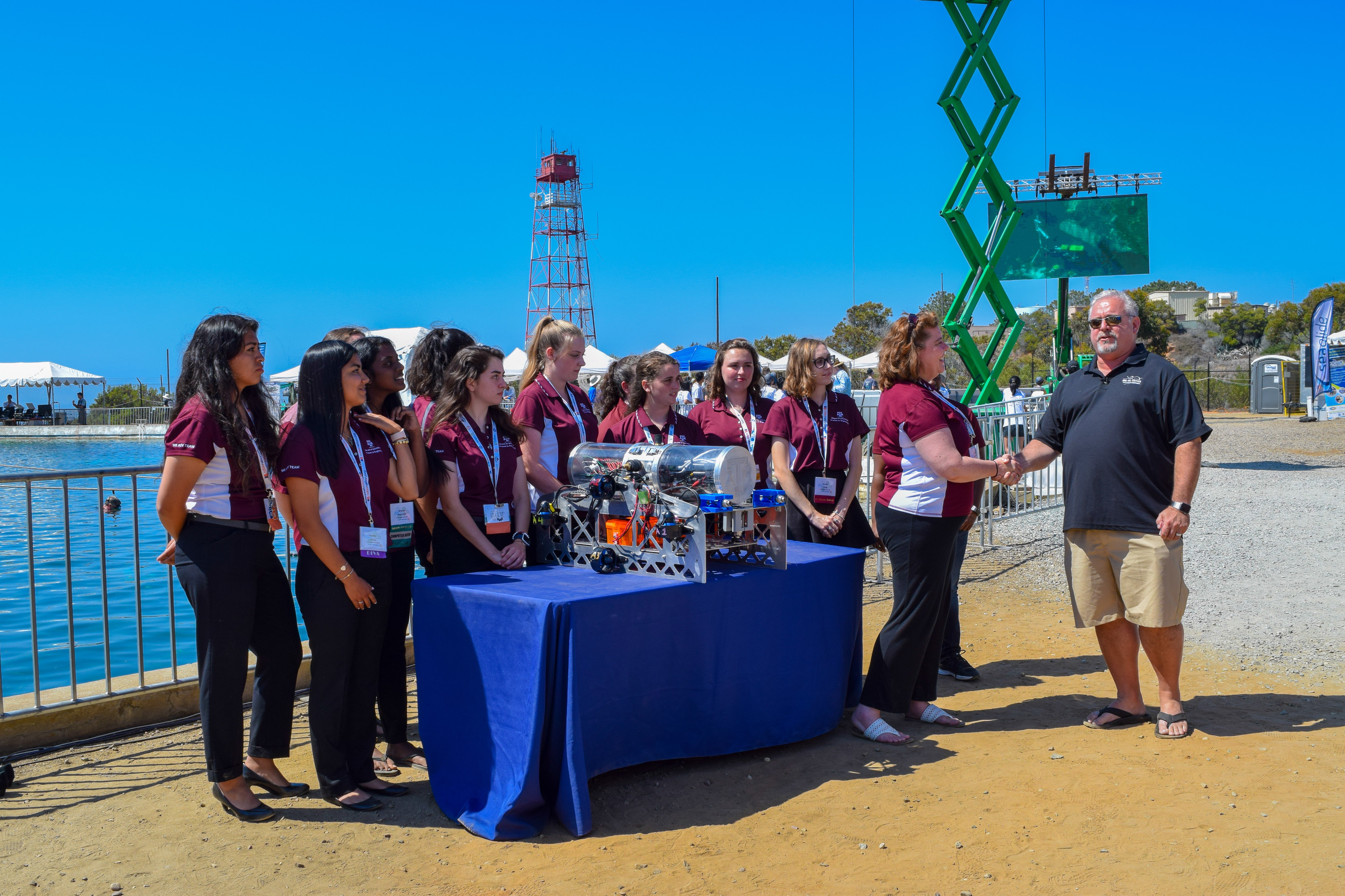 Competitors placing boats in water